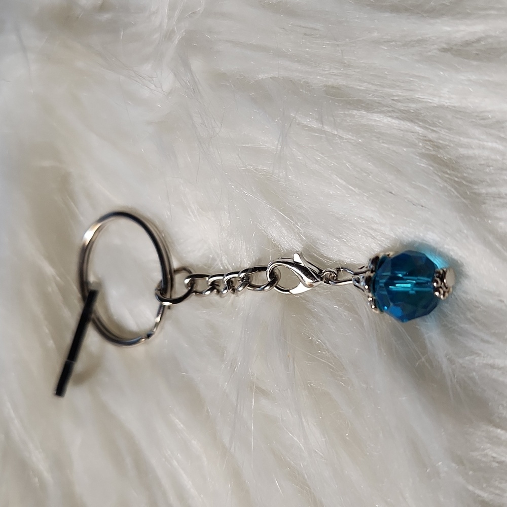Handcrafted key chain with light blue stone